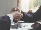 Image of two businesspeople shaking hands